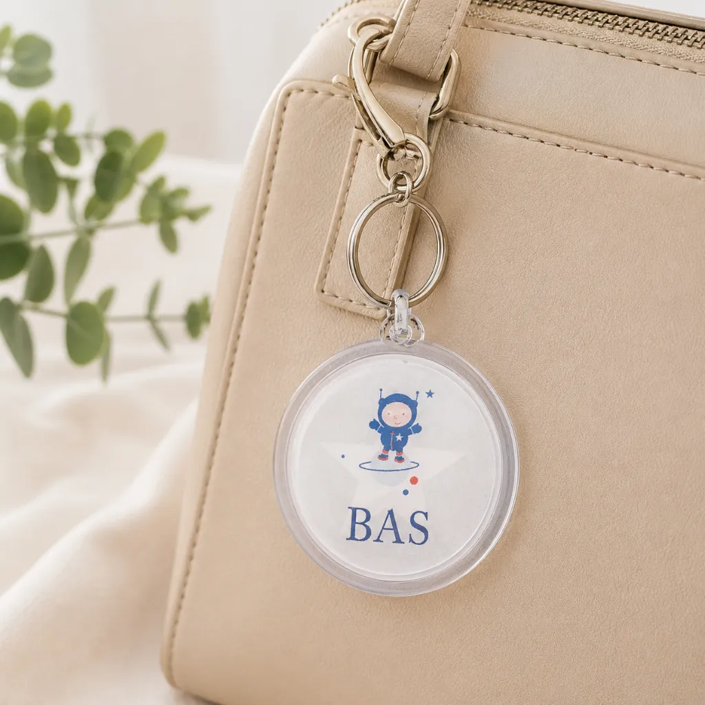 Ronde-plexi-sleutelhanger-aan-tas.webp